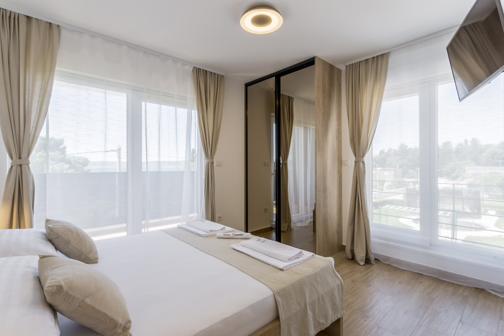 Room 2 - Double Bed, Bathroom, Sat-TV, Wardrobe, Working Table, Towel and Sheets, AC, Balcony With Sea View