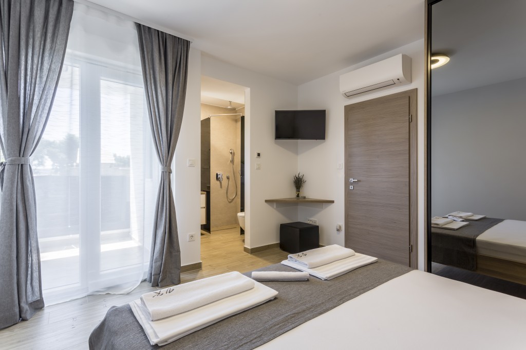Room 1 - Double Bed, Bathroom, Sat-TV, Wardrobe, Working Table, Towel and Sheets, AC, Balcony With Sea View