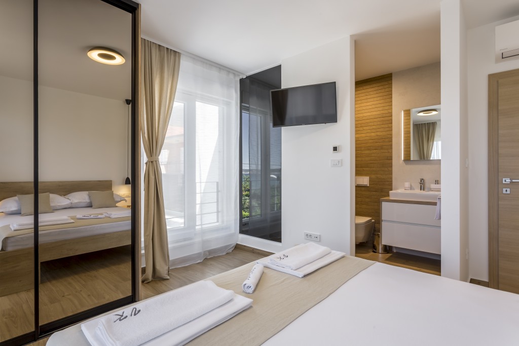 Room 2 - Double Bed, Bathroom, Sat-TV, Wardrobe, Working Table, Towel and Sheets, AC, Balcony With Sea View