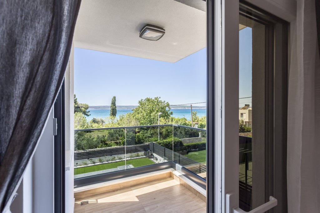 Room 1 - Double Bed, Bathroom, Sat-TV, Wardrobe, Working Table, Towel and Sheets, AC, Balcony With Sea View