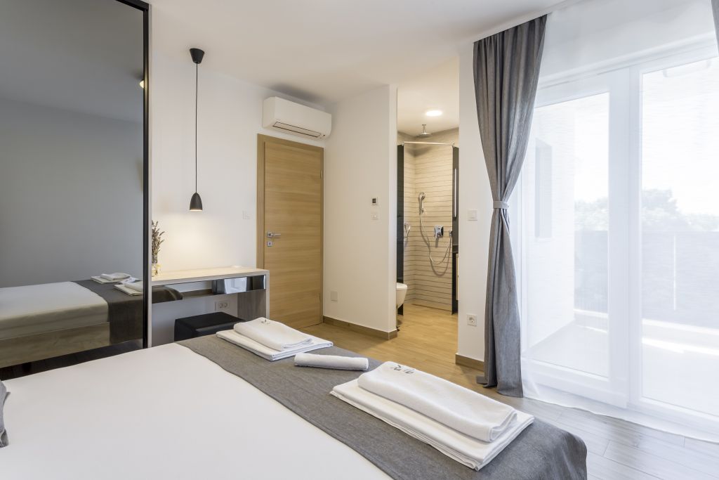 Room 1 - Double Bed, Bathroom, Sat-TV, Wardrobe, Working Table, Towel and Sheets, AC, Balcony With Sea View